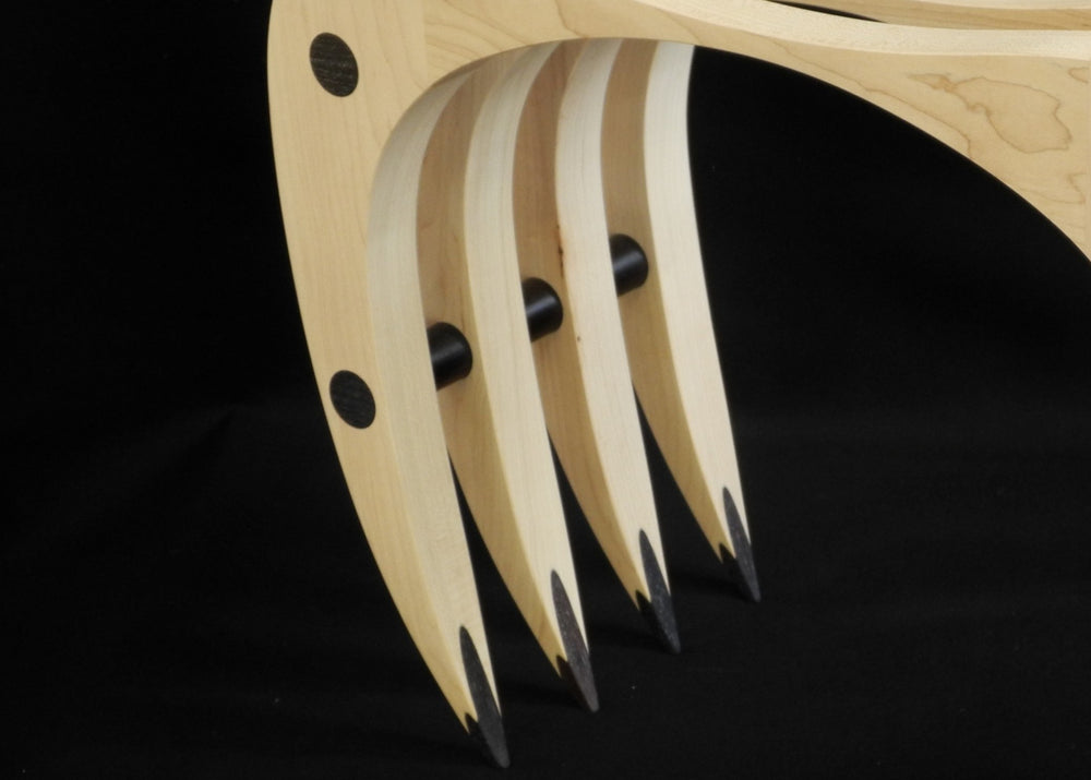 Crab Stool by Max McCance, a one-off sculptural seat in oak and lignum vitae, with curved arched legs that evoke the stance of a crab, combining fragility of form with surprising strength and comfort.