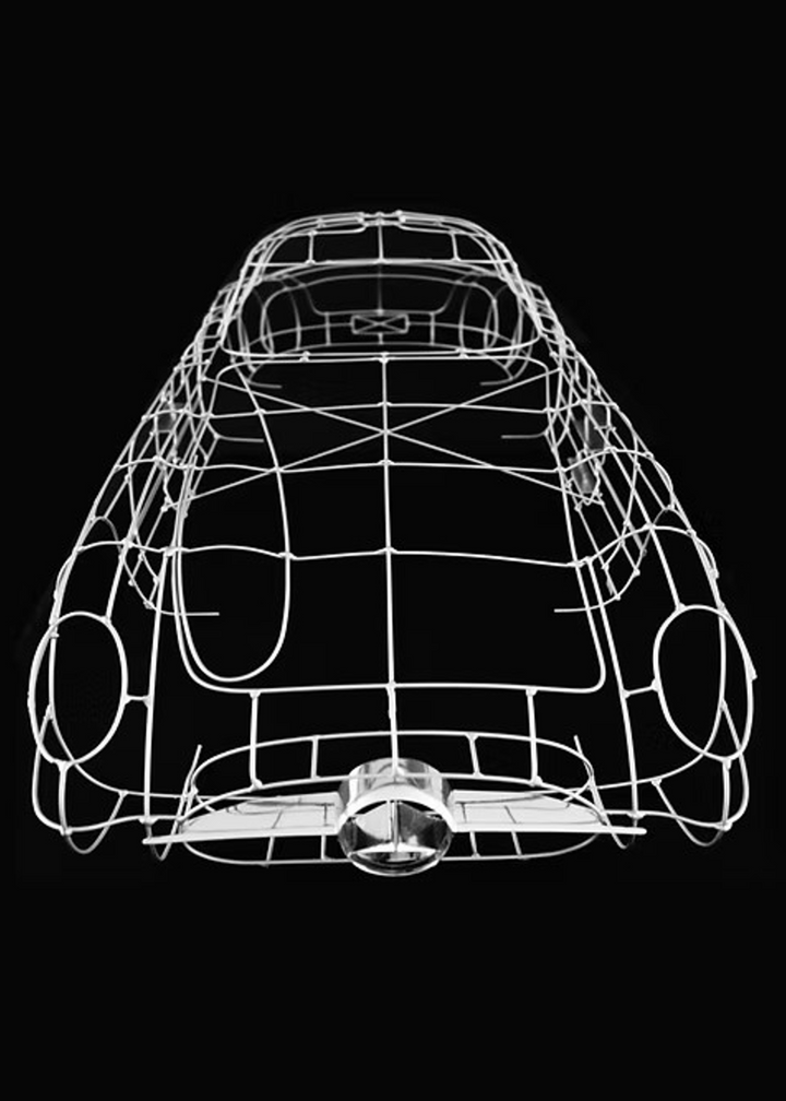 Handcrafted Mercedes-Benz 300 SLR Coupé wire sculpture by Chris Twitchell, inspired by the legendary 1955 Uhlenhaut prototype designed by Friedrich Geiger. Sculpted from precision-formed steel and finished in silver grey DB180, this wall-mounted piece reimagines one of the rarest and most valuable cars ever built — a celebration of German engineering excellence, aerodynamic form, and timeless automotive design.
