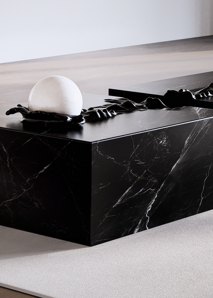 Duffy London Pearl Table sculptural marble coffee table with carved ripple effect and spherical pearl element, creating the illusion of water frozen in motion.