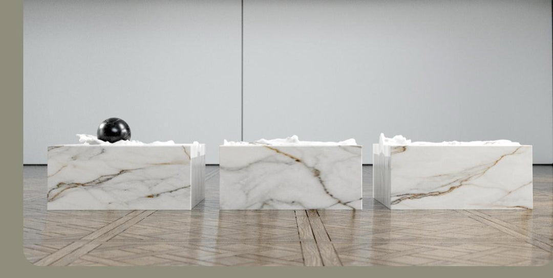 Duffy London Pearl Table sculptural marble coffee table with carved ripple effect and spherical pearl element, creating the illusion of water frozen in motion.