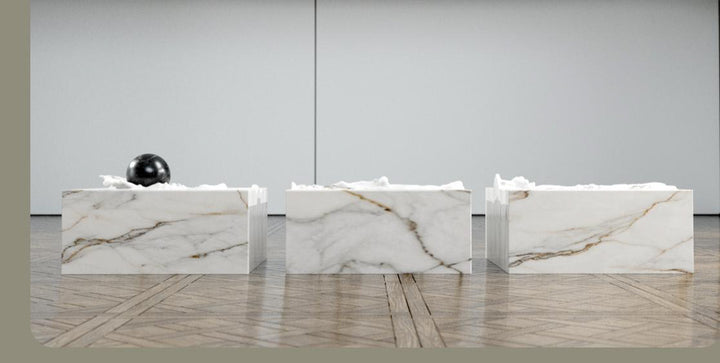 Duffy London Pearl Table sculptural marble coffee table with carved ripple effect and spherical pearl element, creating the illusion of water frozen in motion.