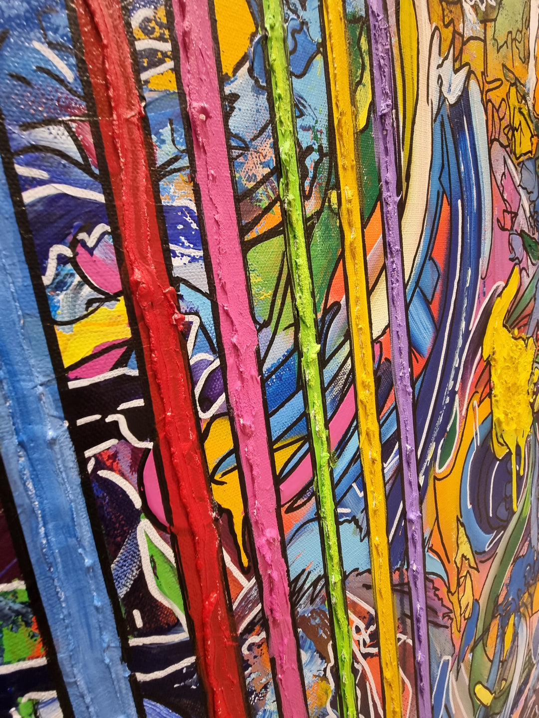 A vibrant abstract graffiti painting filled with layered colours, bold linework and dripping textures, with vertical multicoloured stripes cutting through the centre and two small 3D resin hearts emerging from the surface. The artwork blends chaotic movement with structured lines, creating a vivid, energetic, contemporary statement piece.