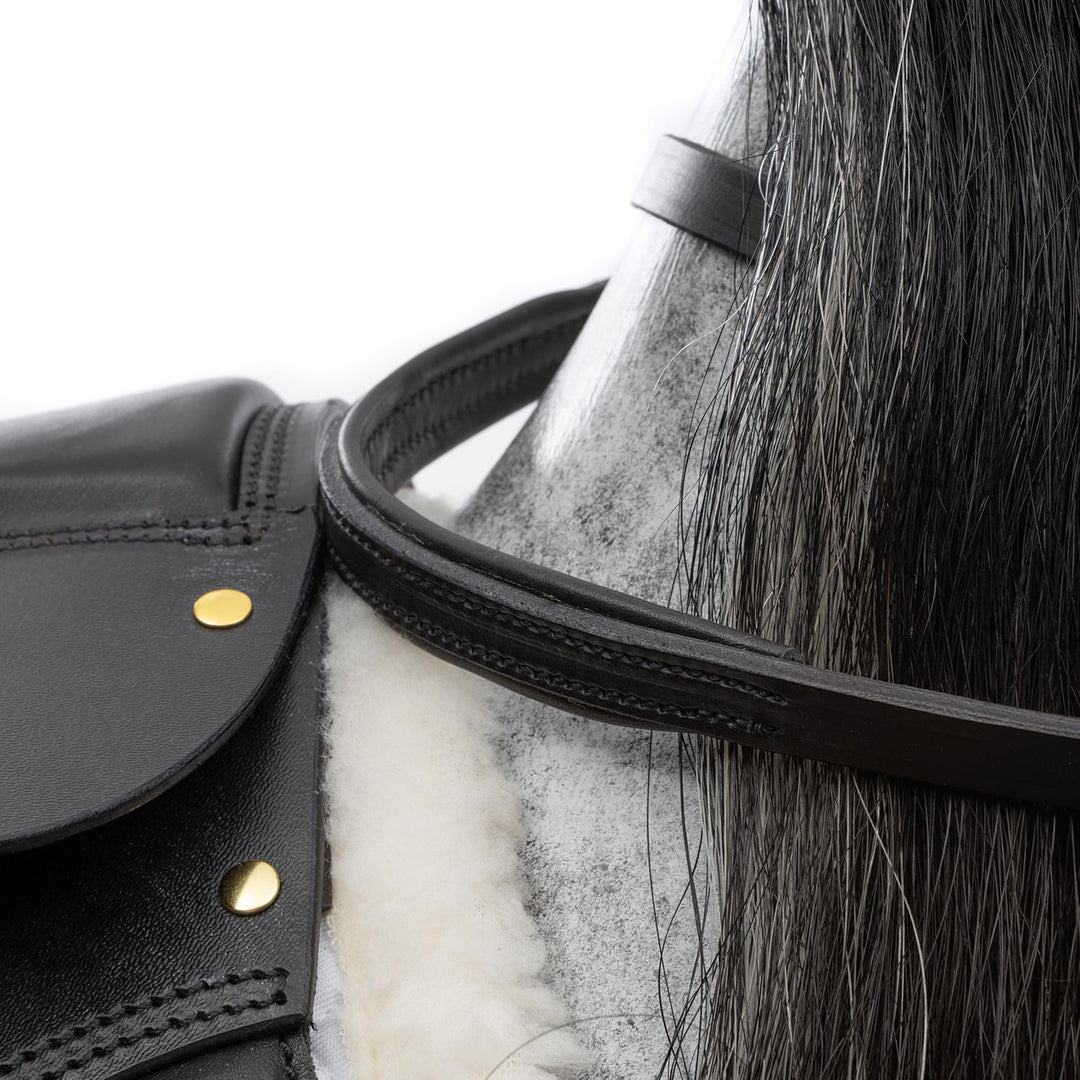 Hand-painted dapple grey rocking horse with long black and white mane, black leather saddle, and oak safety stand.

