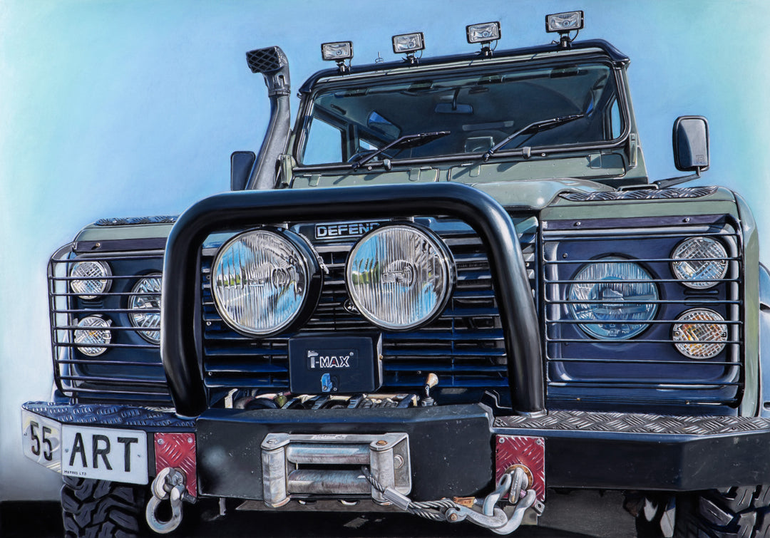 Pastel artwork depicting a Land Rover Defender viewed head-on, tightly framed to emphasise the grille, headlights, bull bar, winch and bonnet details, with worn paintwork, metal textures, glass reflections and subtle surface marks rendered in sharp hyper-realist detail against a clear blue sky.