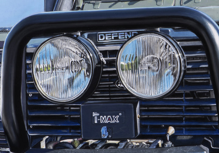 Pastel artwork depicting a Land Rover Defender viewed head-on, tightly framed to emphasise the grille, headlights, bull bar, winch and bonnet details, with worn paintwork, metal textures, glass reflections and subtle surface marks rendered in sharp hyper-realist detail against a clear blue sky.