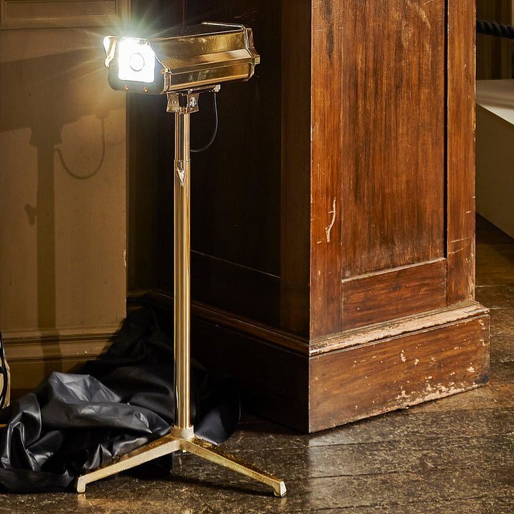 “CCTV Lights – Desk Top” by Ben Rousseau – a sculptural gold-plated LED lamp on a tripod base, reimagining the CCTV camera as a symbol of modern luxury and design. A provocative fusion of technology, art, and illumination.