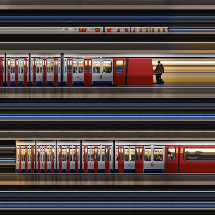 Richard P Jones District Line #2, London fine art photographic print showing layered London Underground District Line trains and commuters moving through a station platform, created from reconstructed high-speed video imagery and printed as a giclée on brushed aluminium.