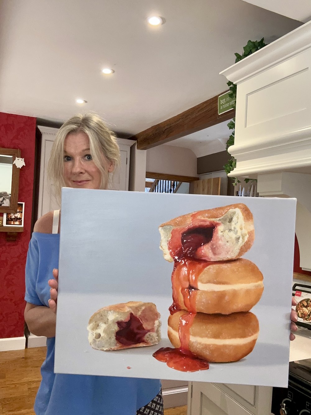 Hyperrealist painting of stacked jelly doughnuts with vivid red jam oozing down the sides