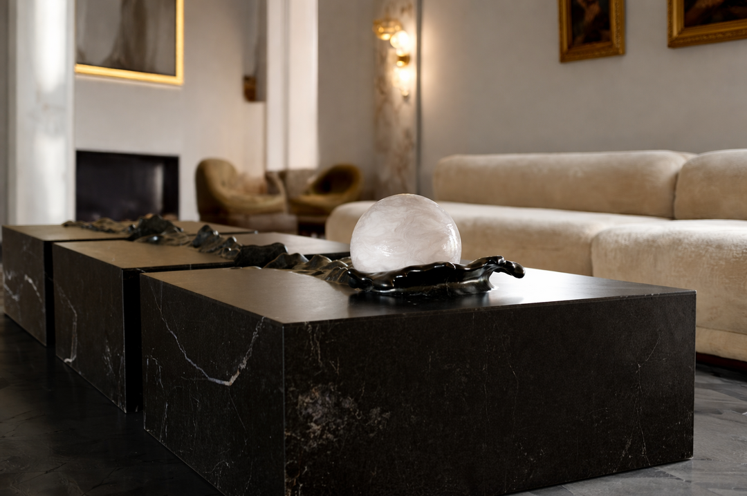 Duffy London Pearl Table sculptural marble coffee table with carved ripple effect and spherical pearl element, creating the illusion of water frozen in motion.