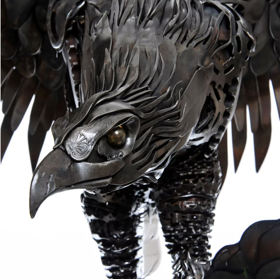 Handcrafted metal american eagle sculpture made from reclaimed steel, featuring detailed feathers, outstretched wings, and steampunk-inspired design.