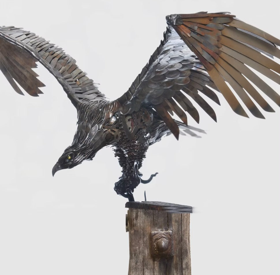 Handcrafted metal american eagle sculpture made from reclaimed steel, featuring detailed feathers, outstretched wings, and steampunk-inspired design.