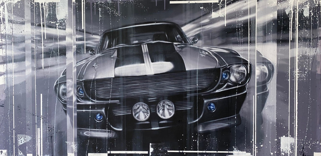 ‘Eleanor’ by Kris Hardy, an original contemporary automotive painting in oil and acrylic on aluminium, depicting the iconic Ford Mustang Eleanor from a dramatic front-facing perspective. The classic American muscle car features bold black and silver bonnet stripes, a wide front grille, twin central driving lamps and subtle electric blue headlight details. Painted in monochromatic shades of black, charcoal, silver, grey and white, with blurred light trails, expressive paint splashes and vertical drips creati