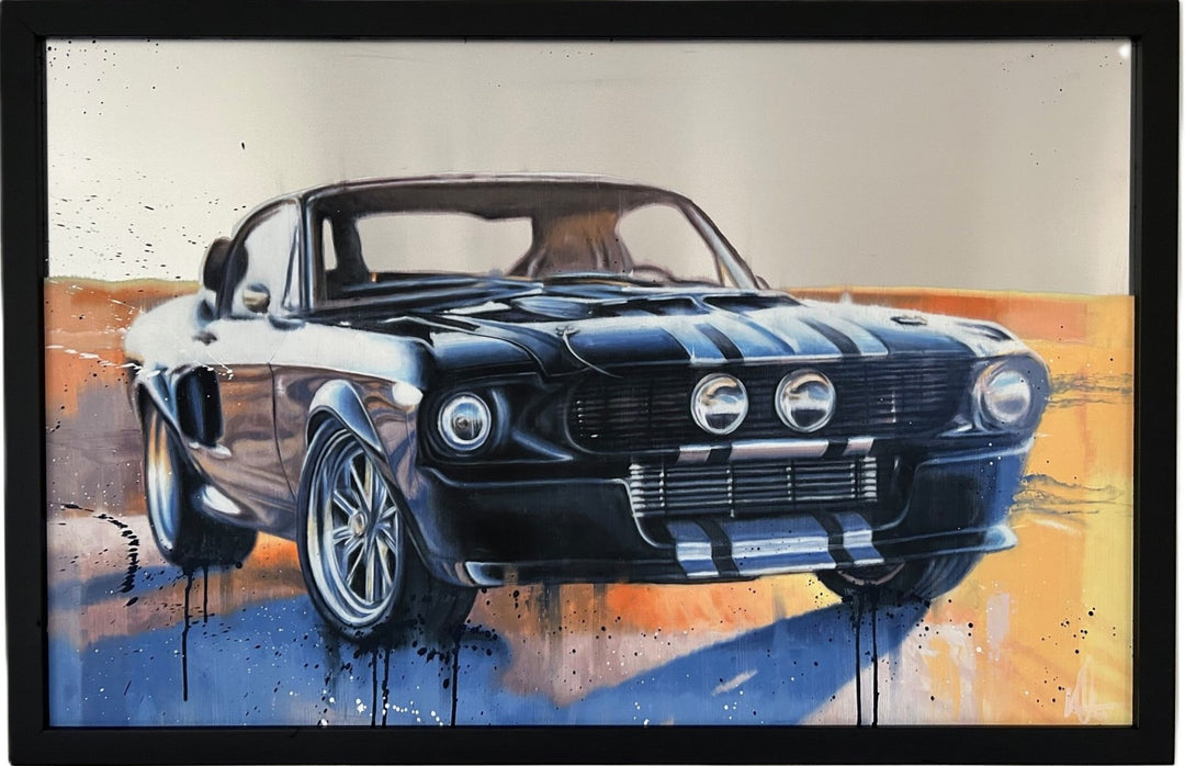‘Eleanor II’ by Kris Hardy, an original contemporary automotive painting in oil on aluminium depicting the iconic Ford Mustang Eleanor, inspired by the Shelby GT500, from a dramatic front three-quarter perspective. The classic American muscle car features dark blue and black bodywork, silver racing stripes, a wide front grille, twin central driving lamps, polished alloy wheels and a muscular low stance. Set against a warm orange, amber and cream background, the artwork combines realistic automotive detailin