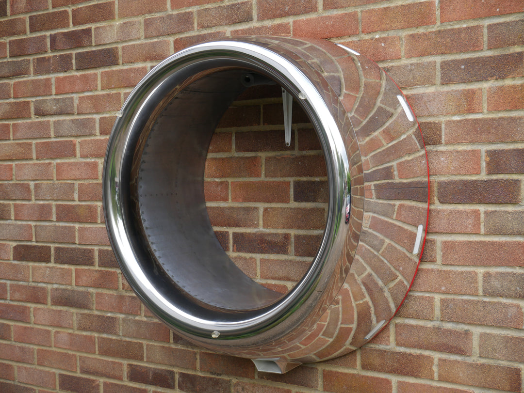 “Hawker Jet” by Ben Rousseau – a one-of-one illuminated wall timepiece created from a genuine aluminium Hawker jet engine intake with mirrored glass and LEDs. A fusion of aviation heritage, engineering, and contemporary art.

