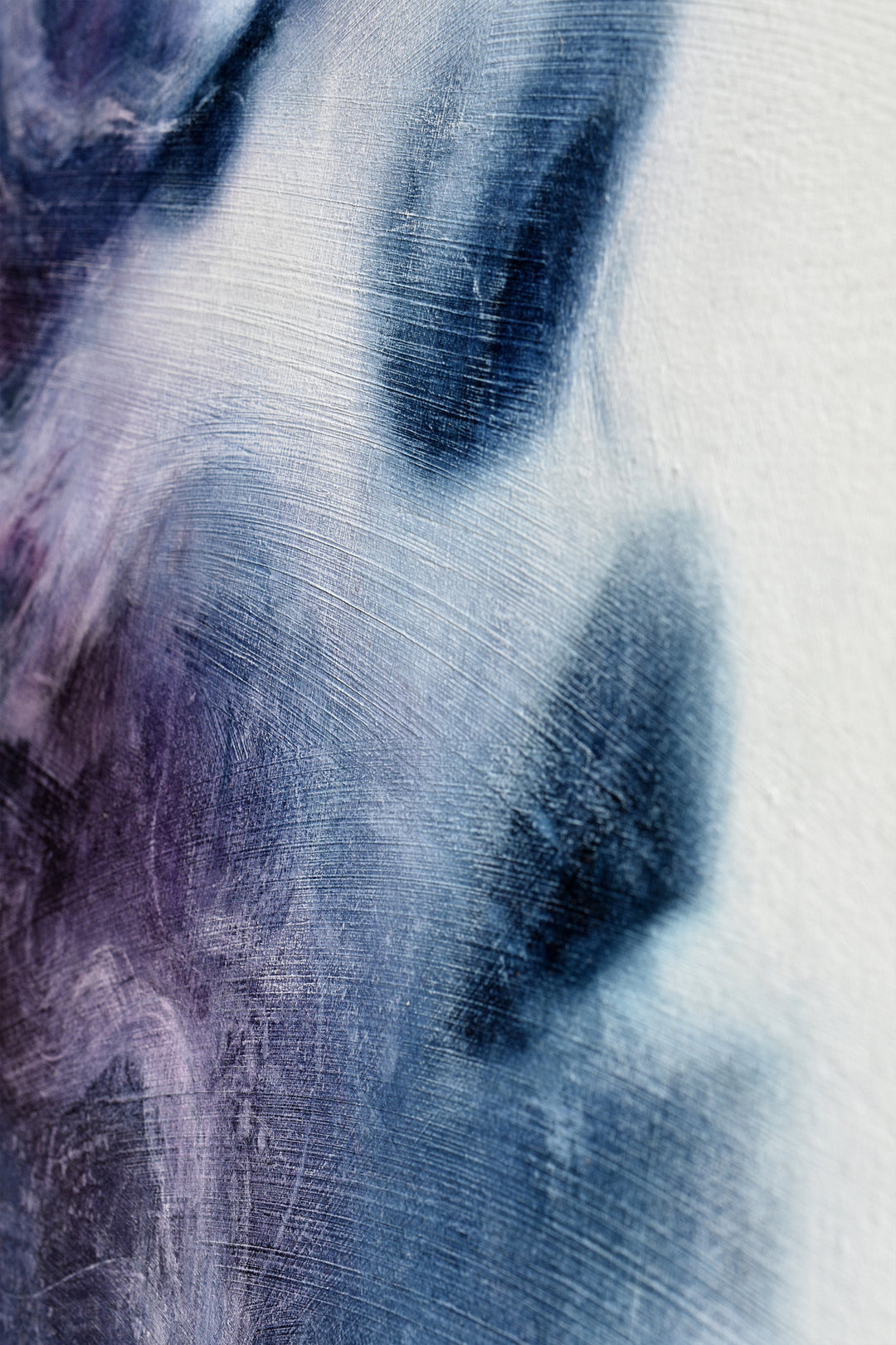 Oil on canvas painting by Dan Bullock, titled Eternal. A dreamlike portrait of a woman’s face in profile, eyes closed, emerging from swirling textures of deep indigo, violet, and soft lavender. The ethereal brushwork gives the impression of smoke or mist, creating a sense of serenity, timelessness, and transcendence.