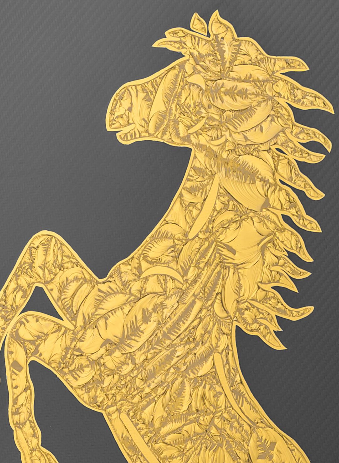 Cavallino Carbon by Vince Edmunds, a handcrafted automotive artwork featuring Ferrari’s prancing horse emblem rendered in genuine 24-carat gold leaf and glue chipped glass against a dark carbon fibre background, presented in a satin black frame with a fine gold sight line.