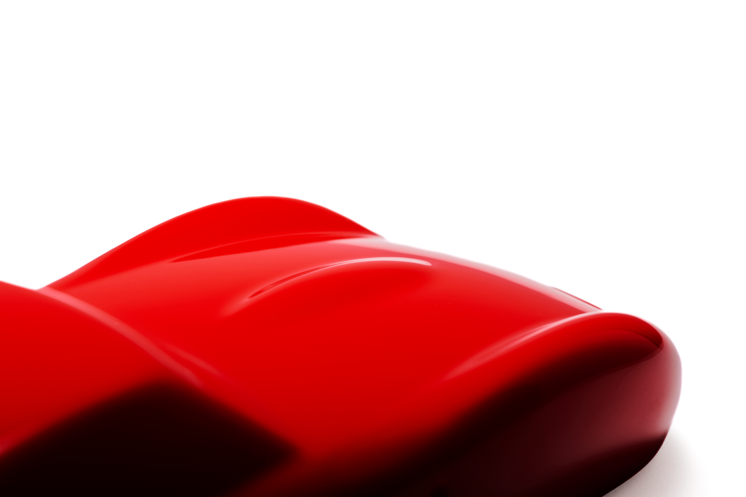 ‘Ferrari 250 GTO’ by Sreeni Gandra, a limited-edition contemporary automotive sculpture from the Forme di Velocità series, inspired by the iconic Ferrari 250 GTO designed by Sergio Scaglietti. Presented in a striking high-gloss Rosso Corsa red finish, the sculpture captures the car's flowing aerodynamic silhouette, elongated bonnet, sculpted wheel arches, distinctive triple front air intakes and elegant fastback roofline. Its smooth, minimalist surfaces celebrate the pure form and timeless character of one 