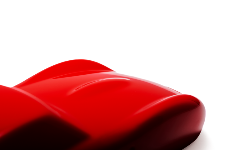 ‘Ferrari 250 GTO’ by Sreeni Gandra, a limited-edition contemporary automotive sculpture from the Forme di Velocità series, inspired by the iconic Ferrari 250 GTO designed by Sergio Scaglietti. Presented in a striking high-gloss Rosso Corsa red finish, the sculpture captures the car's flowing aerodynamic silhouette, elongated bonnet, sculpted wheel arches, distinctive triple front air intakes and elegant fastback roofline. Its smooth, minimalist surfaces celebrate the pure form and timeless character of one 