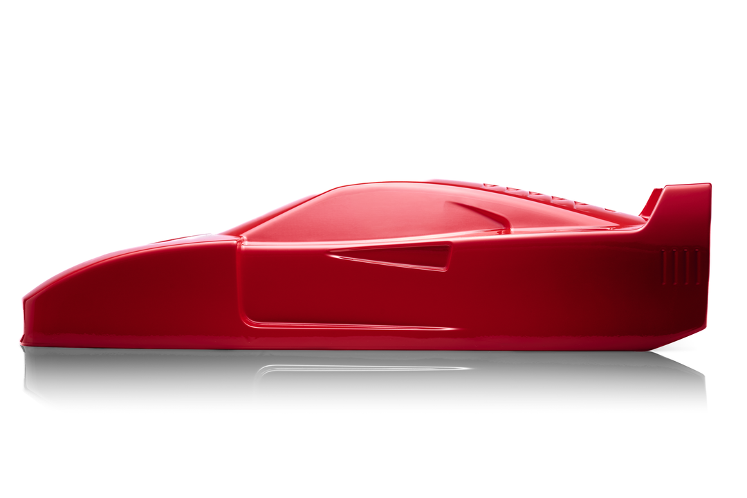 ‘Ferrari F40’ by Srini Gandra, a limited-edition contemporary automotive sculpture from the Forme di Velocità series, inspired by the legendary Ferrari F40, the final Ferrari personally approved by Enzo Ferrari. Presented in a striking high-gloss Rosso Corsa red finish, the sculpture captures the supercar's low wedge-shaped profile, sculpted bonnet, aerodynamic side intakes, distinctive rear engine vents and iconic elevated rear wing. Its smooth, minimalist surfaces celebrate the raw performance, aerodynami