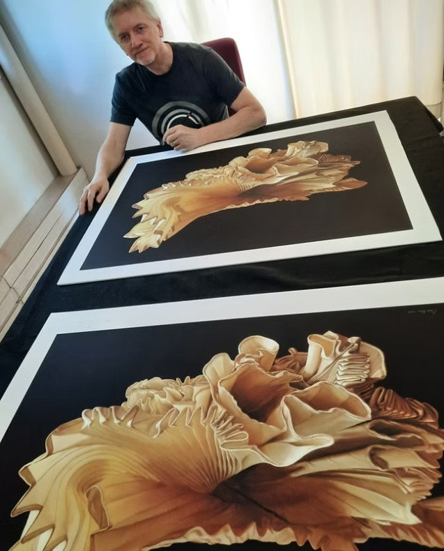 Limited edition fine art print of a hyperrealist acrylic painting by Chris Klein, depicting the iconic pleated stage top worn by Freddie Mercury, designed by Dame Zandra Rhodes, presented against a black background.