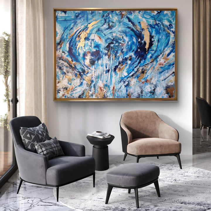 Highly textured blue and gold abstract painting with sweeping circular motion, cascading drips and layered brushstrokes, evoking water, movement and freedom, framed in a gold tray frame.