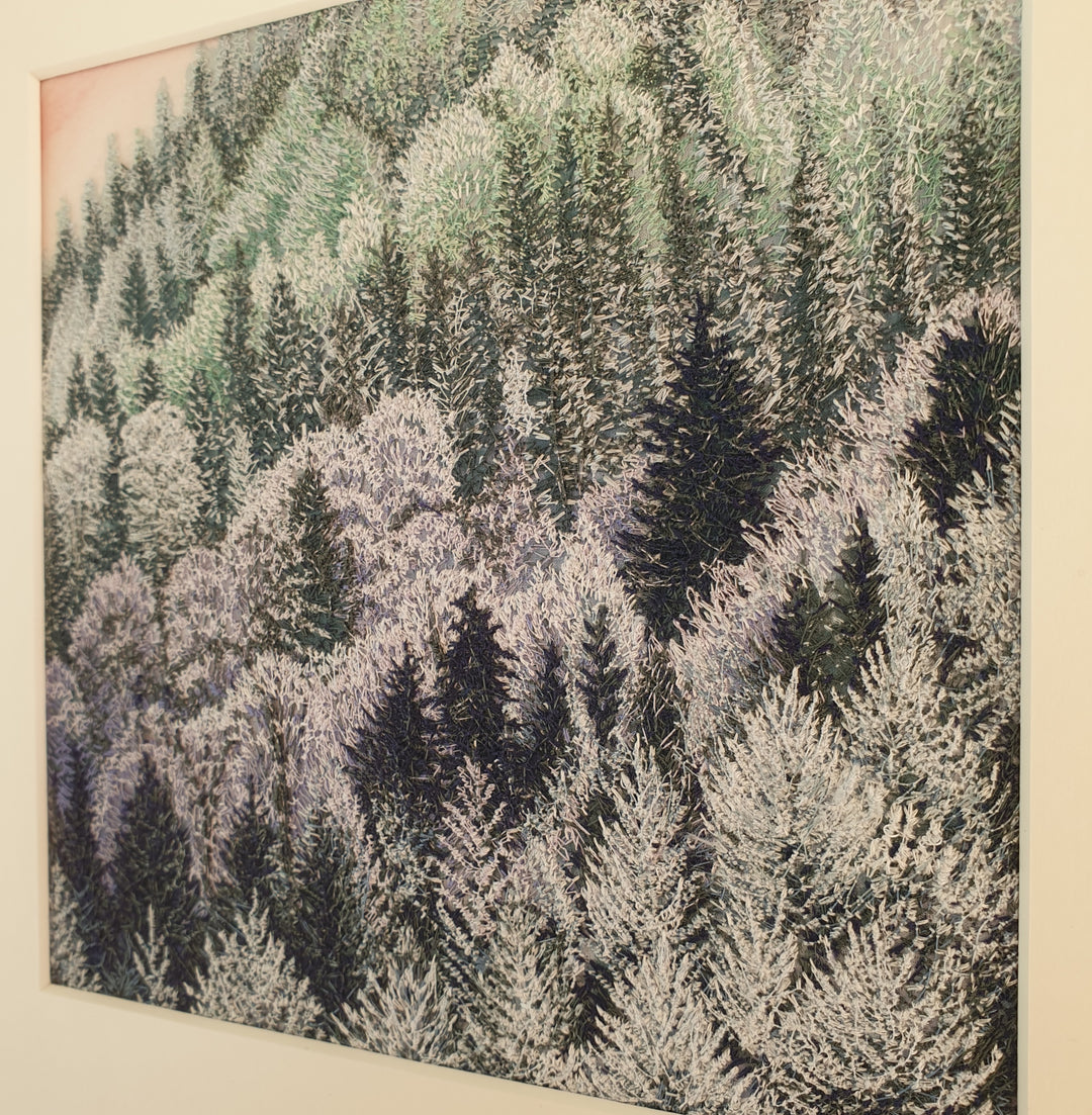 Layered embroidered forest scene with dense pine trees in muted shades of lavender, green, and deep navy thread.
