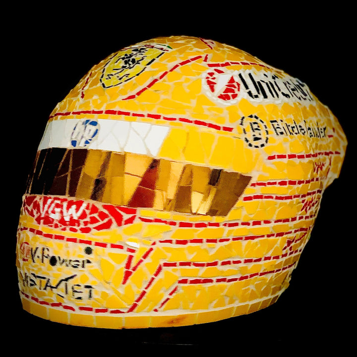 Full-size Ferrari-inspired Formula 1 helmet mosaic sculpture, handcrafted from individually cut ceramic tiles in red, yellow, white, black, and metallic gold. This bespoke artwork captures the energy and precision of motorsport design, created as an example of a custom commission.