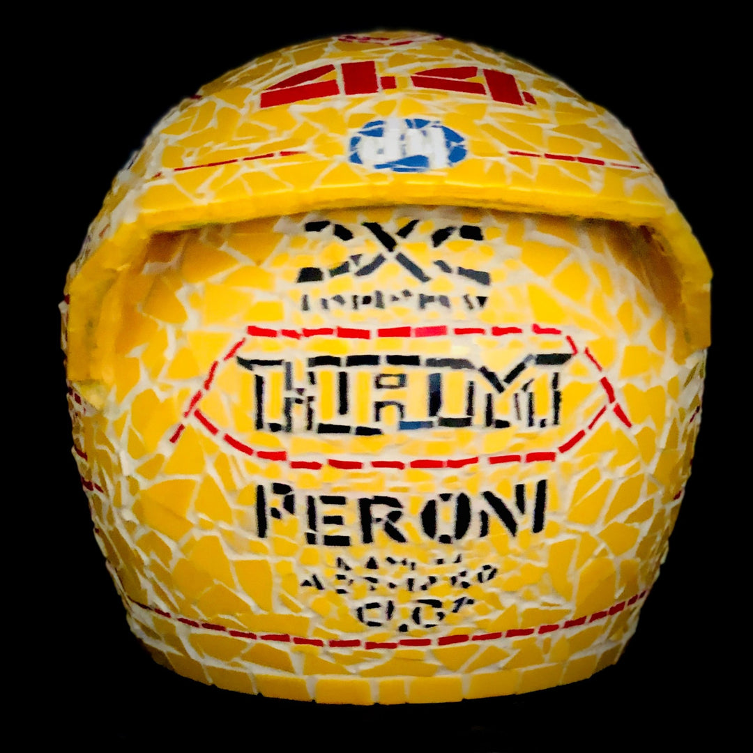 Full-size Ferrari-inspired Formula 1 helmet mosaic sculpture, handcrafted from individually cut ceramic tiles in red, yellow, white, black, and metallic gold. This bespoke artwork captures the energy and precision of motorsport design, created as an example of a custom commission.