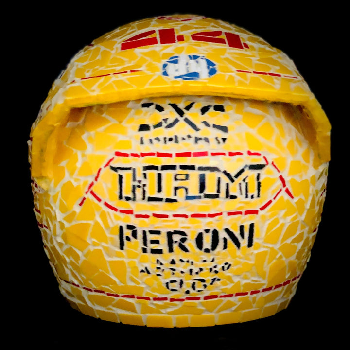 Full-size Ferrari-inspired Formula 1 helmet mosaic sculpture, handcrafted from individually cut ceramic tiles in red, yellow, white, black, and metallic gold. This bespoke artwork captures the energy and precision of motorsport design, created as an example of a custom commission.