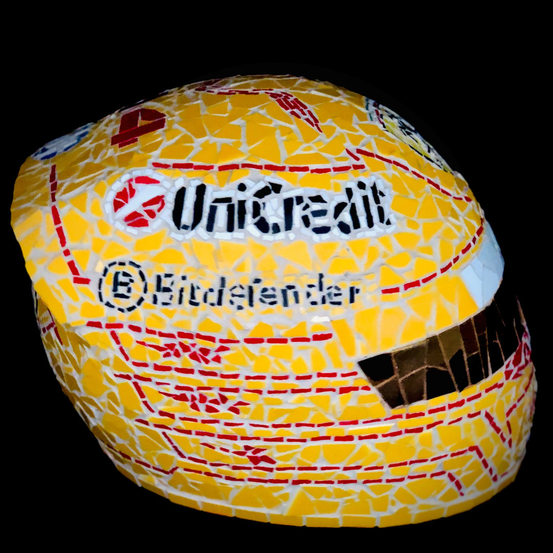 Full-size Ferrari-inspired Formula 1 helmet mosaic sculpture, handcrafted from individually cut ceramic tiles in red, yellow, white, black, and metallic gold. This bespoke artwork captures the energy and precision of motorsport design, created as an example of a custom commission.