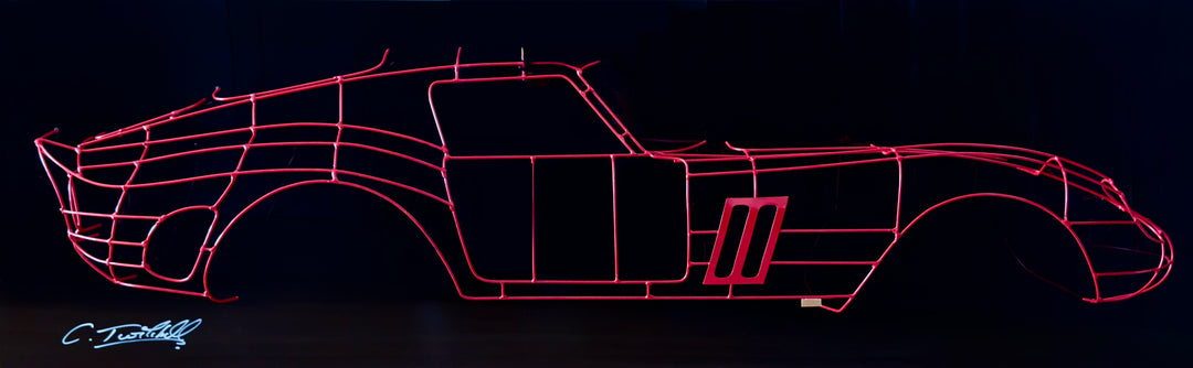 Handcrafted Ferrari 250 GTO wire sculpture by Chris Twitchell, capturing the elegant profile of the legendary 1962 Series 1 Scaglietti body. Finished in Rosso Chiaro red and mounted on a sleek black panel, this sculptural study reimagines the original Maranello buck in minimalist wire form — a fusion of precision engineering, Italian design, and contemporary British craftsmanship.