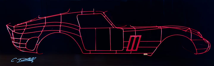 Handcrafted Ferrari 250 GTO wire sculpture by Chris Twitchell, capturing the elegant profile of the legendary 1962 Series 1 Scaglietti body. Finished in Rosso Chiaro red and mounted on a sleek black panel, this sculptural study reimagines the original Maranello buck in minimalist wire form — a fusion of precision engineering, Italian design, and contemporary British craftsmanship.