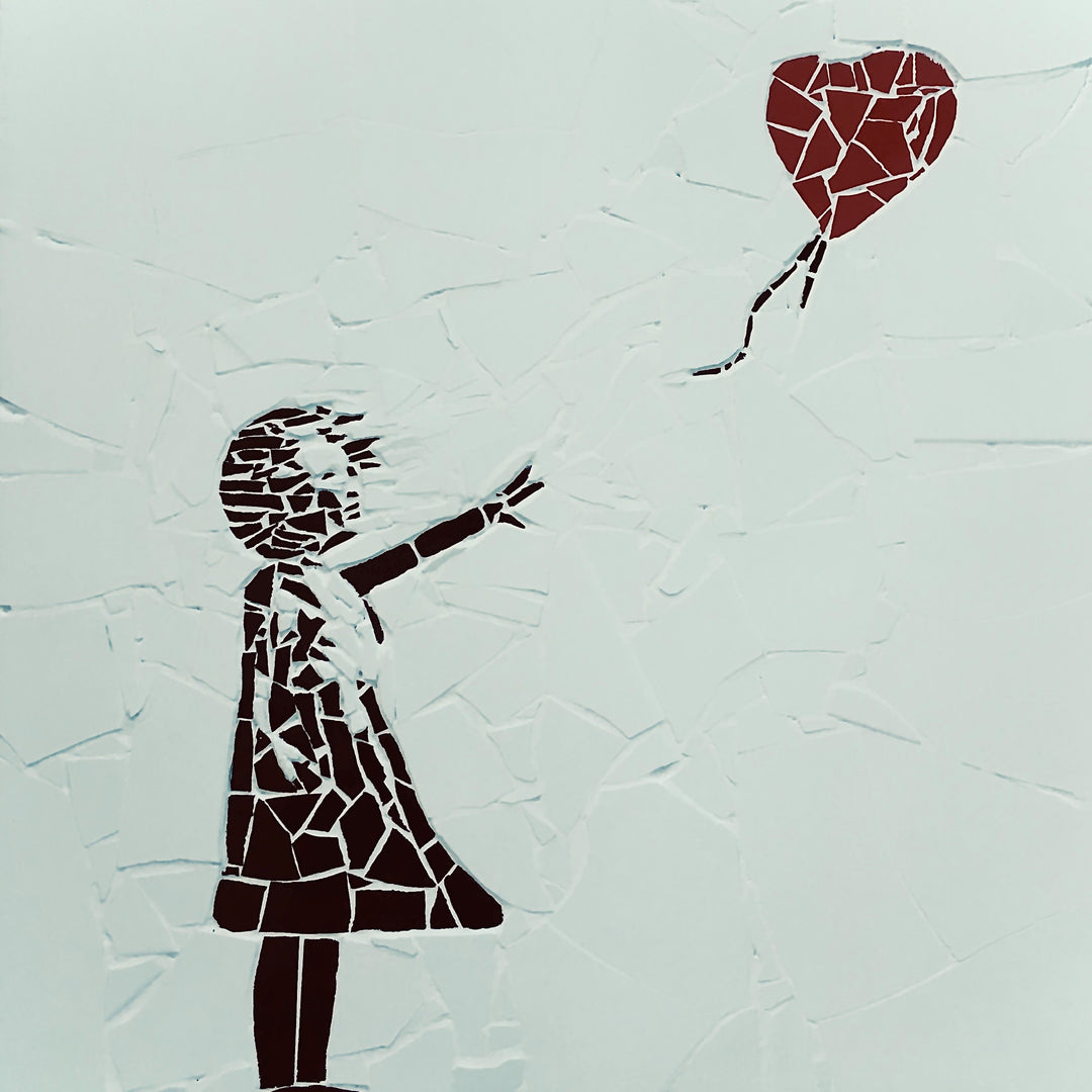 “Girl with Balloon” mosaic — a handcrafted ceramic tile artwork reimagining the iconic heart balloon image. Featuring black and white tiles with a vivid red heart, this bespoke commission blends street art symbolism with fine mosaic craftsmanship.