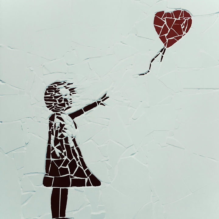 “Girl with Balloon” mosaic — a handcrafted ceramic tile artwork reimagining the iconic heart balloon image. Featuring black and white tiles with a vivid red heart, this bespoke commission blends street art symbolism with fine mosaic craftsmanship.