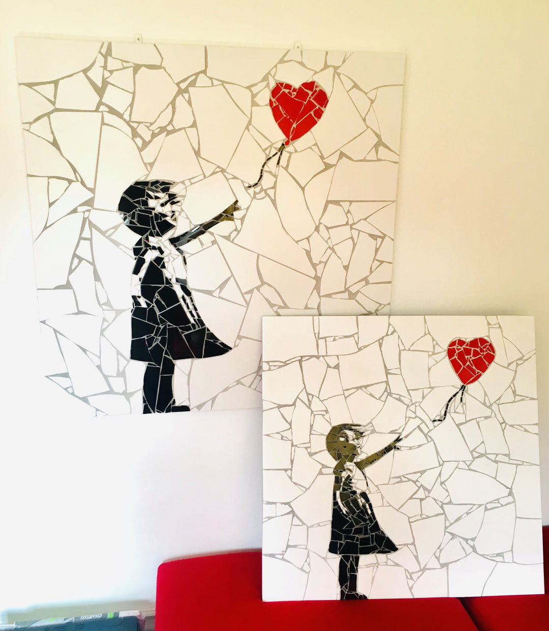 “Girl with Balloon” mosaic — a handcrafted ceramic tile artwork reimagining the iconic heart balloon image. Featuring black and white tiles with a vivid red heart, this bespoke commission blends street art symbolism with fine mosaic craftsmanship.