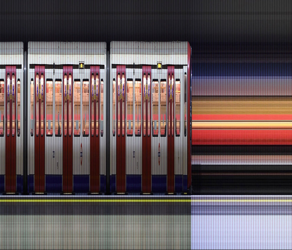 A high-speed reconstructed video print capturing the movement of London Underground trains at Gloucester Road Station. Strips of colour blur horizontally, representing the pulse of the city as it emerges from the COVID-19 pandemic—blending abstraction, motion, and structure into a visual rhythm of urban life.