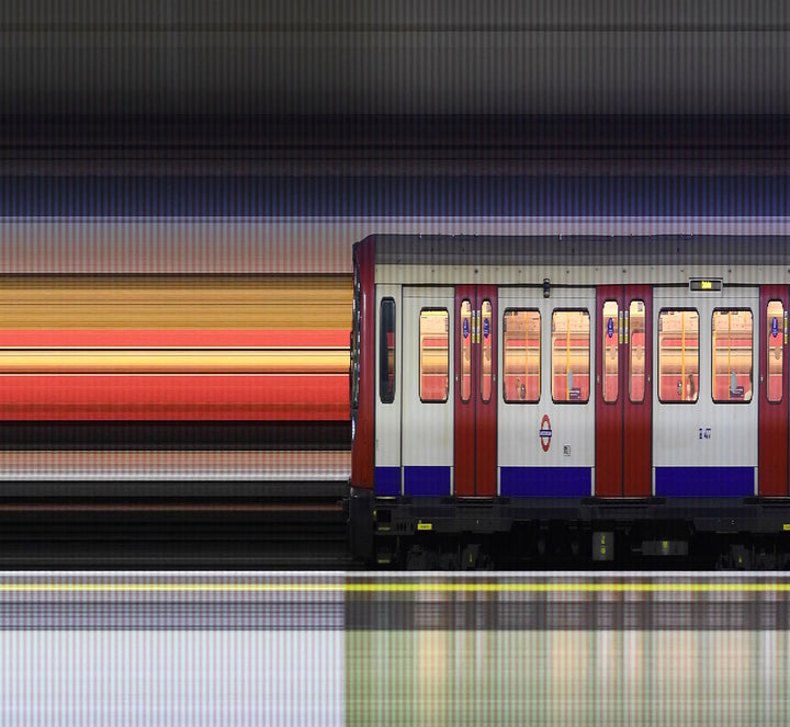 A high-speed reconstructed video print capturing the movement of London Underground trains at Gloucester Road Station. Strips of colour blur horizontally, representing the pulse of the city as it emerges from the COVID-19 pandemic—blending abstraction, motion, and structure into a visual rhythm of urban life.