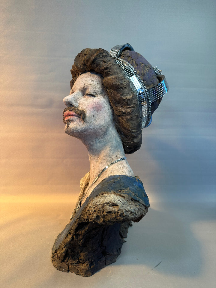 Contemporary ceramic bust sculpture by Eve Shepherd featuring a raw hand-built female figure wearing a mirrored mosaic crown, combining classical portraiture with modern satire, textured clay surfaces, reflective glass elements and irreverent royal symbolism