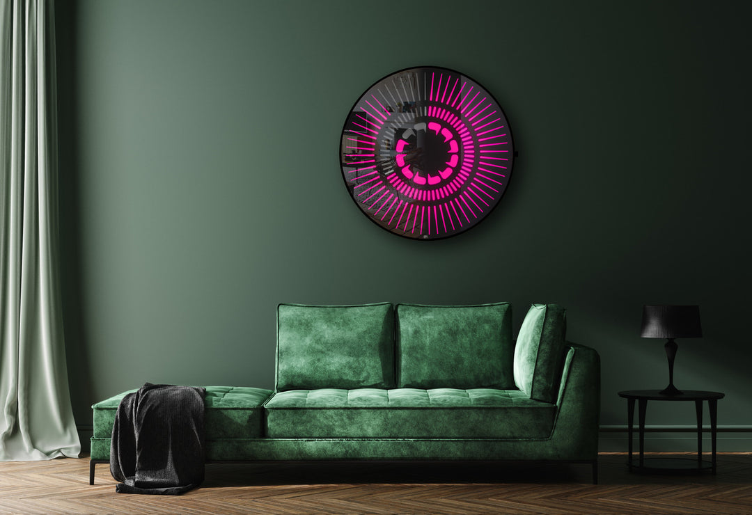“Tempus Obsidian” by Ben Rousseau – a limited-edition illuminated wall timepiece crafted from grey mirrored glass and brass-tinted aluminium with LEDs. Inspired by obsidian, it radiates calm through subtle light and refined design.

