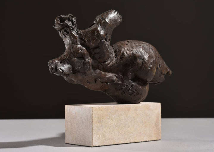 ‘Nude Emergence Torso’ by Hamish Mackie, a limited-edition contemporary bronze figurative sculpture depicting a fragmented reclining female nude torso. Inspired by ancient sculptural artefacts, the abstracted human form features rough, expressive modelling, weathered surfaces and an earthy brown bronze patina. Mounted horizontally on a rectangular Ancaster Weatherbed stone plinth, the sculpture explores the natural beauty and tactile qualities of the female form.