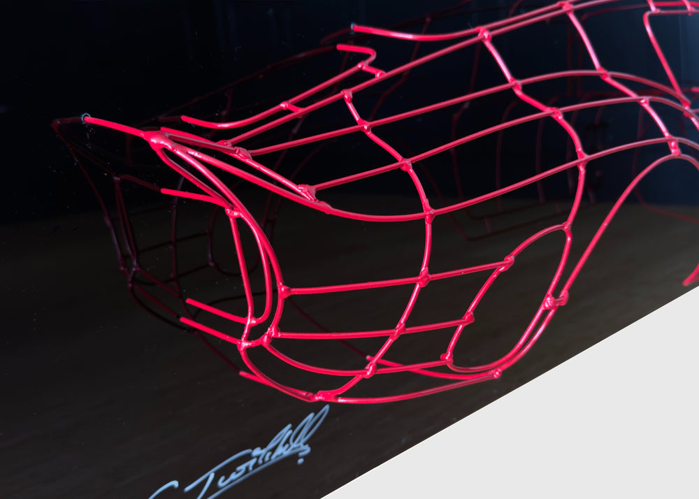 Handcrafted Ferrari 250 GTO wire sculpture by Chris Twitchell, capturing the elegant profile of the legendary 1962 Series 1 Scaglietti body. Finished in Rosso Chiaro red and mounted on a sleek black panel, this sculptural study reimagines the original Maranello buck in minimalist wire form — a fusion of precision engineering, Italian design, and contemporary British craftsmanship.