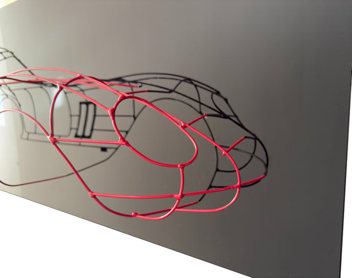 Handcrafted Ferrari 250 GTO wire sculpture by Chris Twitchell, capturing the elegant profile of the legendary 1962 Series 1 Scaglietti body. Finished in Rosso Chiaro red and mounted on a sleek black panel, this sculptural study reimagines the original Maranello buck in minimalist wire form — a fusion of precision engineering, Italian design, and contemporary British craftsmanship.