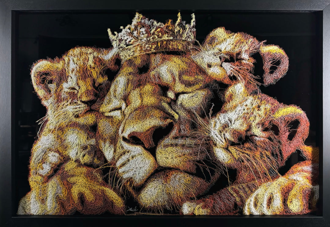 A richly textured injected-scribble artwork depicting a majestic lion wearing a crown, resting peacefully with three lion cubs nestled against him. The composition glows with warm tones of gold, amber, orange and cream, set against a deep black background that enhances the dimensional, thread-like detailing.