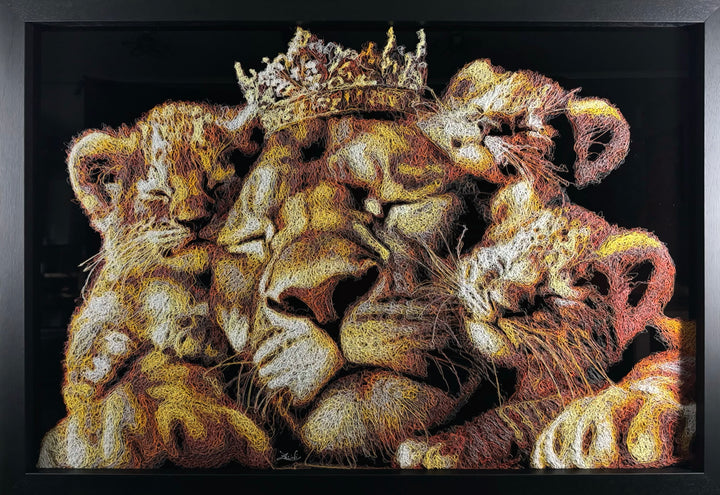 A richly textured injected-scribble artwork depicting a majestic lion wearing a crown, resting peacefully with three lion cubs nestled against him. The composition glows with warm tones of gold, amber, orange and cream, set against a deep black background that enhances the dimensional, thread-like detailing.