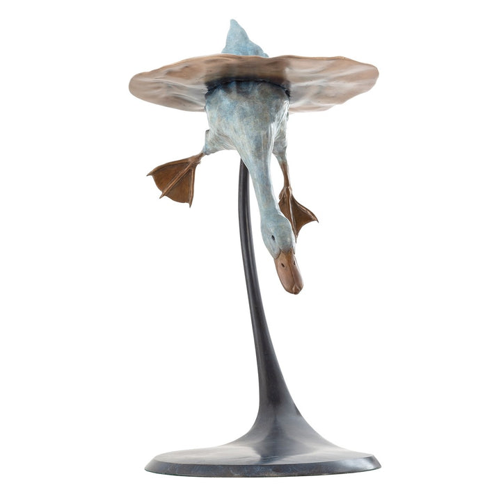 Playful bronze sculpture of a duck diving underwater, with only the rear and feet above a rippled surface, supported by a curved bronze stand — full of character and movement.