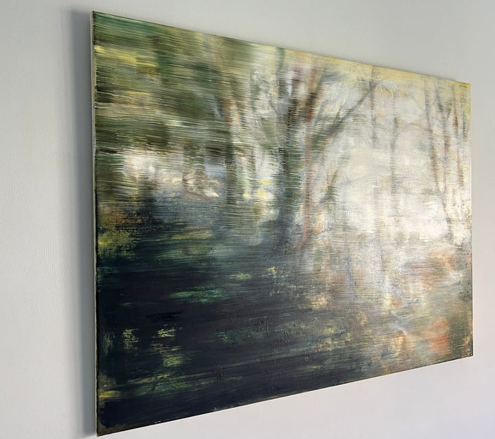 Abstract forest landscape in soft focus, with blurred trees and earthy tones fading into light.