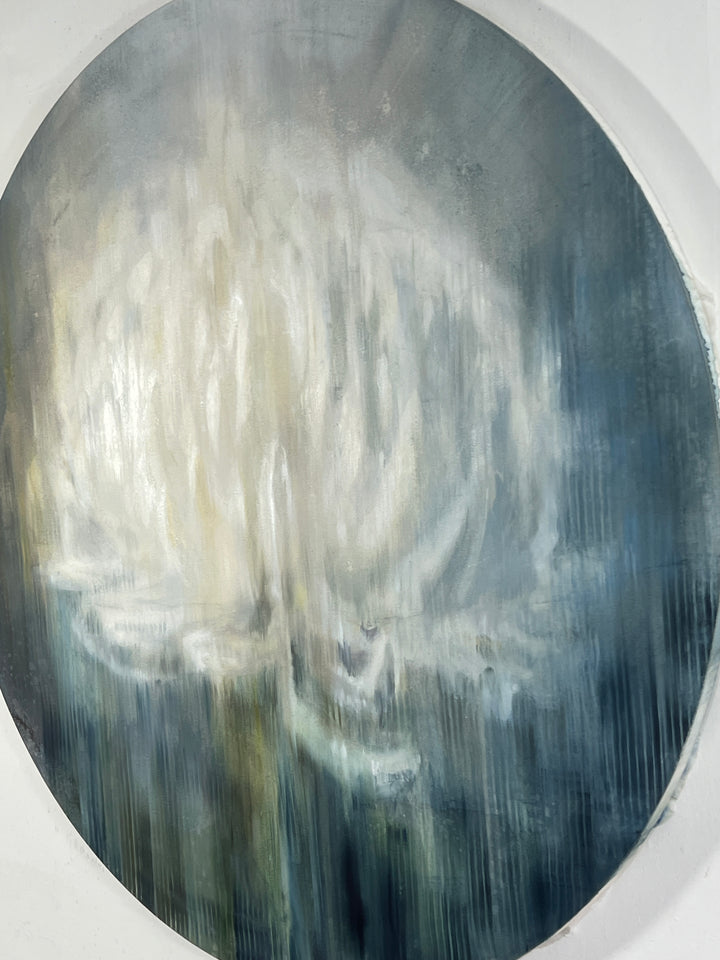 Circular abstract painting of a pale lotus-like bloom on silk and paper in cool grey-blue tones.