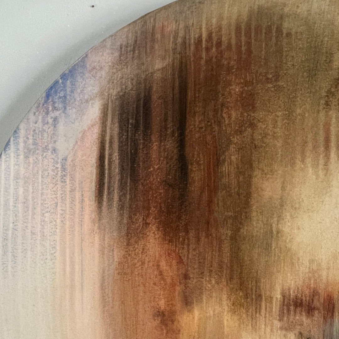 Soft-focus portrait of a pensive face with closed eyes in muted earthy tones on round canvas.