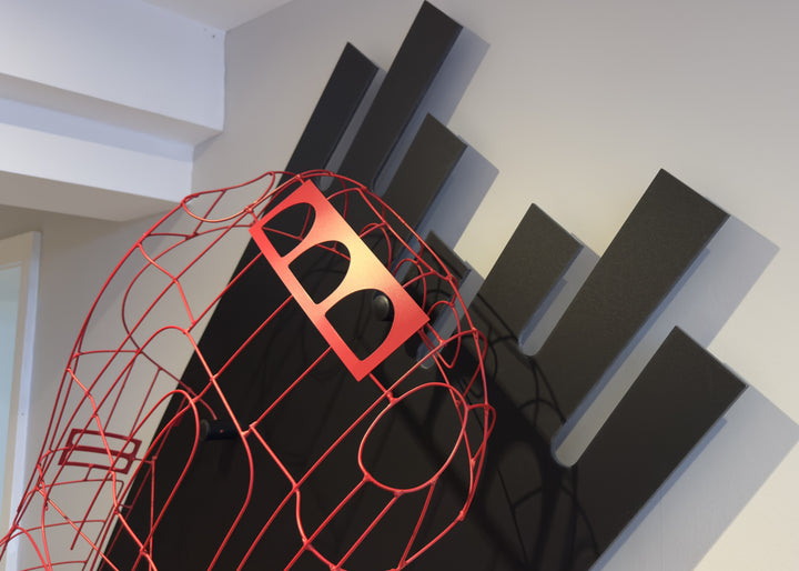 Handcrafted red wire sculpture of the Ferrari 250 GTO by Chris Twitchell, inspired by the original coachbuilder’s buck used to form the legendary 1962 Series 1 body. Finished in Rosso Chiaro red, this intricate wall-mounted artwork captures the elegance, form, and aerodynamics of Scaglietti’s design through sculptural craftsmanship and precision engineering.