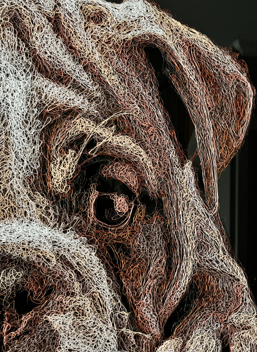 Vibrant injected-scribble artwork of a bulldog puppy resting at the edge of rippling water, its reflection distorted in swirling tones of white, tan, copper and brown, with dense textured linework creating a three-dimensional, energetic surface.